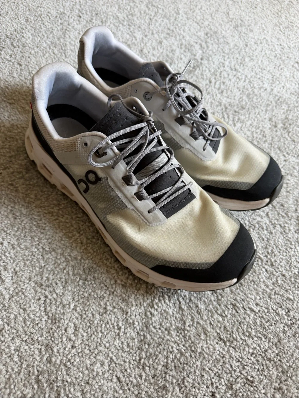 On Running Men’s Athletic Shoes in Off-White and Black